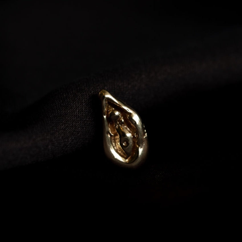 Viva la Vulva! A silver or gold stud earring with a vulva design that also looks like an oyster