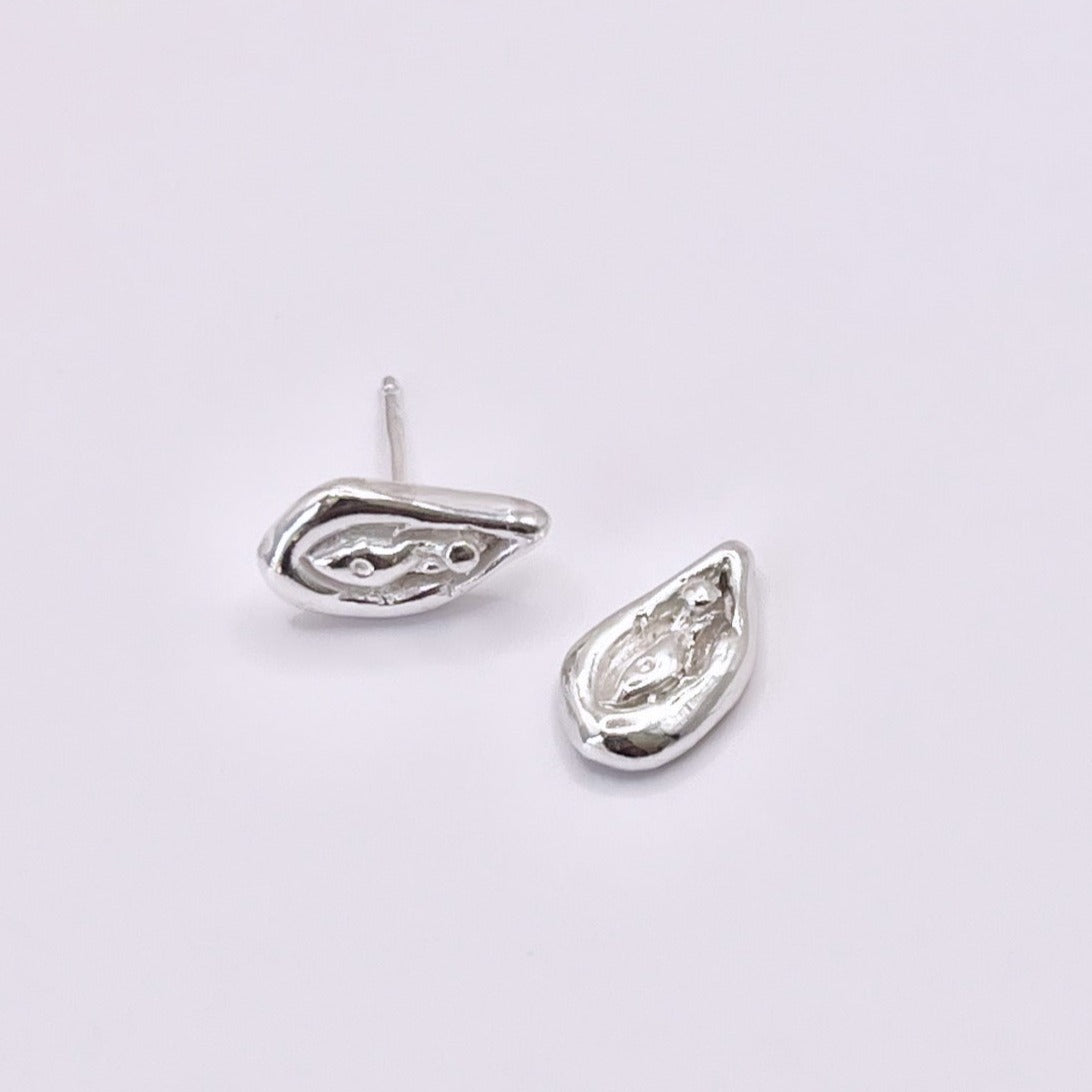 Viva la Vulva! A silver or gold stud earring with a vulva design that also looks like an oyster 