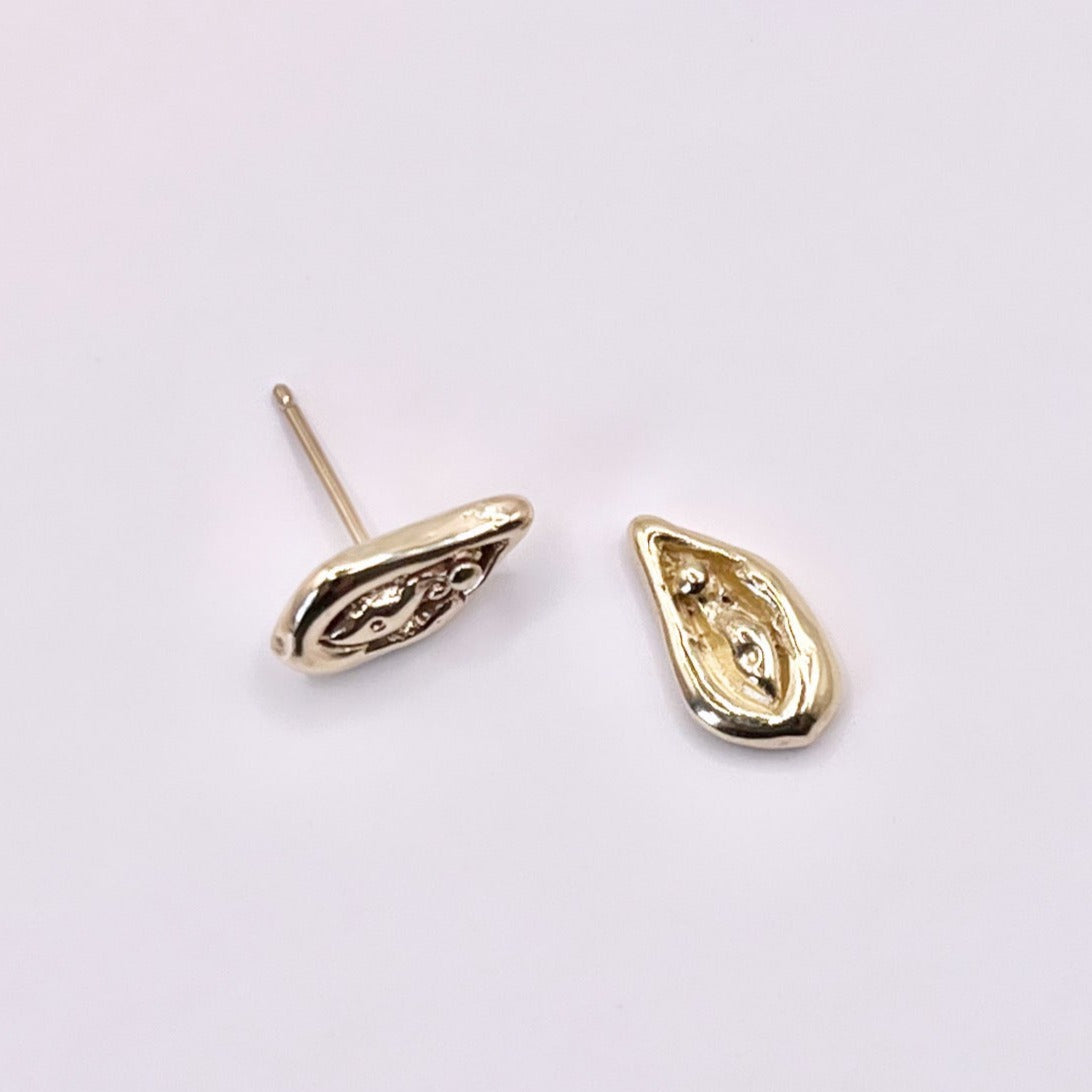 Viva la Vulva! A silver or gold stud earring with a vulva design that also looks like an oyster 