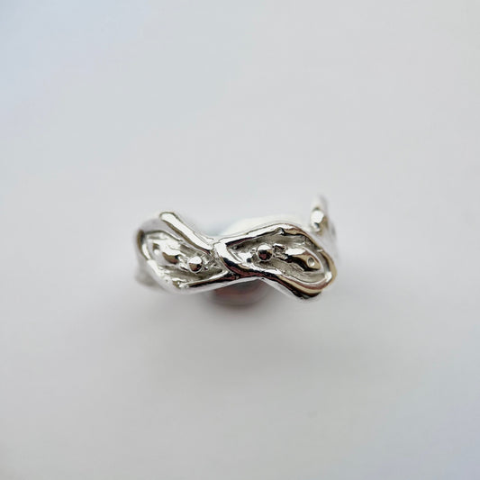 Viva la Vulva! A chunky silver ring with a vulva design that also looks like oysters 