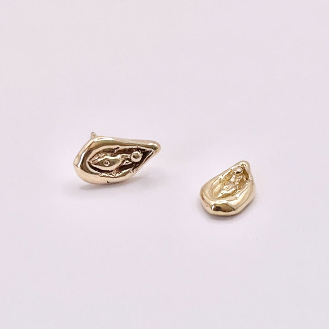 Viva la Vulva! A silver or gold stud earring with a vulva design that also looks like an oyster 